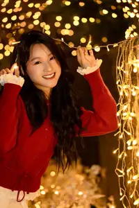 Radiant Smile Girl in Red Amidst Twinkling Lights: Warm Beauty for Festive Season - image 13