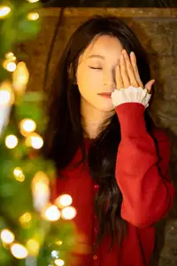 Radiant Smile Girl in Red Amidst Twinkling Lights: Warm Beauty for Festive Season - image 5