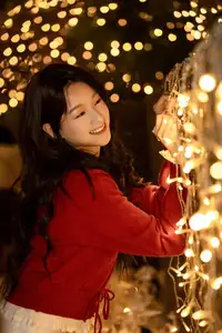 Radiant Smile Girl in Red Amidst Twinkling Lights: Warm Beauty for Festive Season - image 6