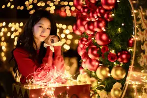 Radiant Smile Girl in Red Amidst Twinkling Lights: Warm Beauty for Festive Season - image 11