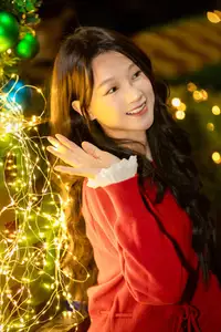 Radiant Smile Girl in Red Amidst Twinkling Lights: Warm Beauty for Festive Season - image 8