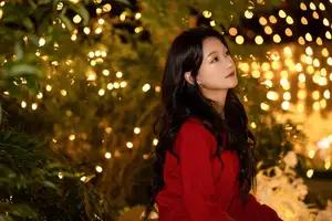 Radiant Smile Girl in Red Amidst Twinkling Lights: Warm Beauty for Festive Season - image 9