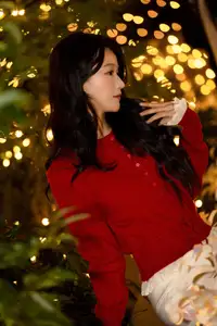 Radiant Smile Girl in Red Amidst Twinkling Lights: Warm Beauty for Festive Season - image 3