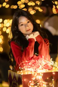 Radiant Smile Girl in Red Amidst Twinkling Lights: Warm Beauty for Festive Season - image 15
