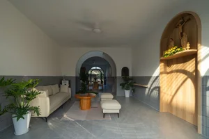 Elegant 2-Story Townhouse Design Featuring Stunning Arched Architectural Accents - image 1