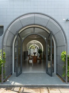 Elegant 2-Story Townhouse Design Featuring Stunning Arched Architectural Accents - image 2