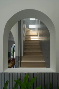 Elegant 2-Story Townhouse Design Featuring Stunning Arched Architectural Accents - image 4
