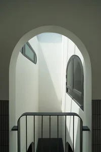 Elegant 2-Story Townhouse Design Featuring Stunning Arched Architectural Accents - image 3