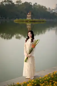 Graceful Ao Dai Vietnamese Beauty Shines Brightly By Serene Lake A Timeless Portrait - image 0