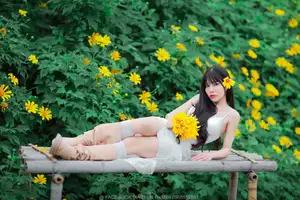 Graceful Young Woman in White Dress Amidst Vibrant Yellow Flowers 1000026997 - image 4