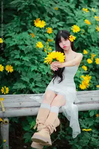 Graceful Young Woman in White Dress Amidst Vibrant Yellow Flowers 1000026997 - image 8