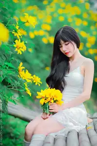 Graceful Young Woman in White Dress Amidst Vibrant Yellow Flowers 1000026997 - image 7