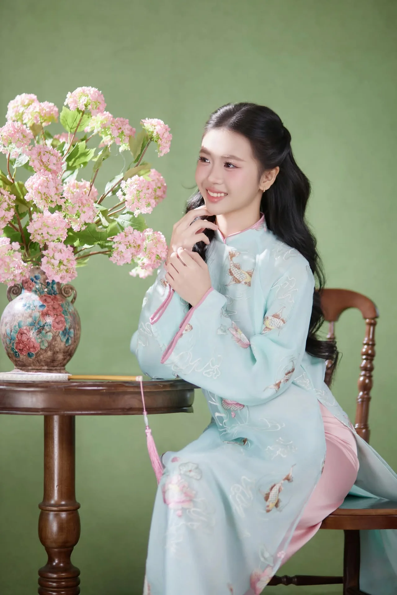 Radiant Elegance in Traditional Blue Attire and Spring Blooms