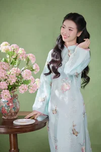 Radiant Elegance in Traditional Blue Attire and Spring Blooms - image 5