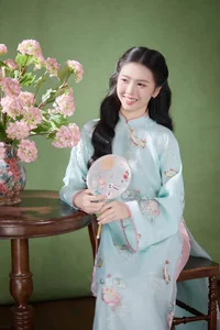 Radiant Elegance in Traditional Blue Attire and Spring Blooms - image 8