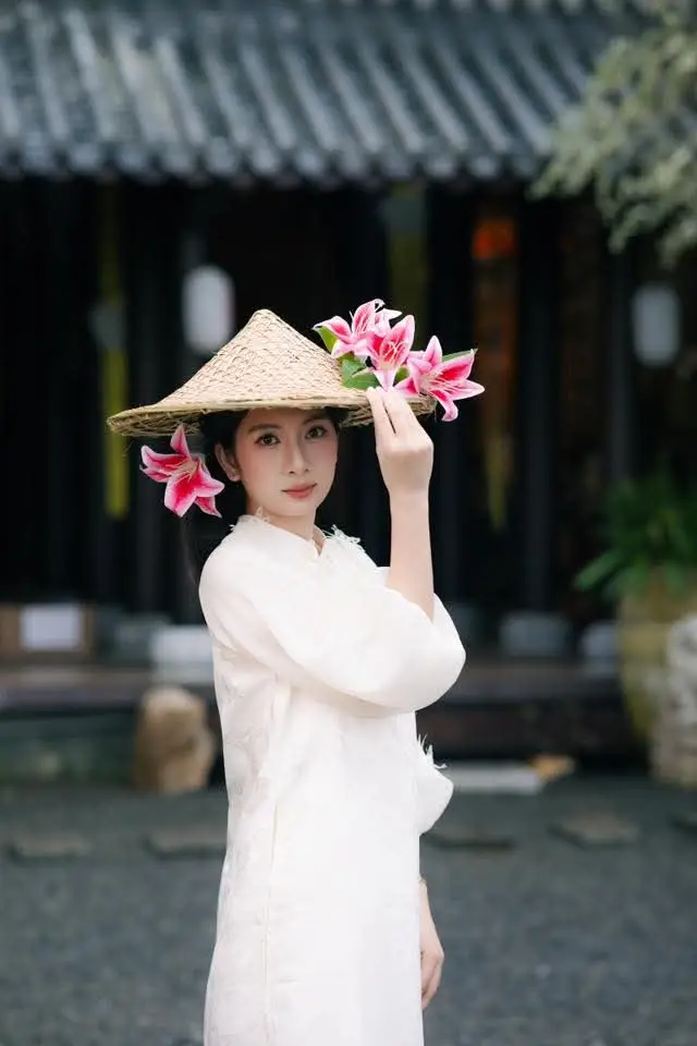 Elegant Vietnamese Beauty with Flowers