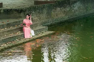 Elegant Pink Ao Dai Amidst Ancient Architecture Capturing Timeless Traditional Beauty - image 9