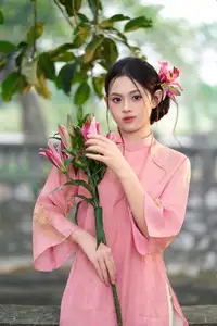 Elegant Pink Ao Dai Amidst Ancient Architecture Capturing Timeless Traditional Beauty - image 4