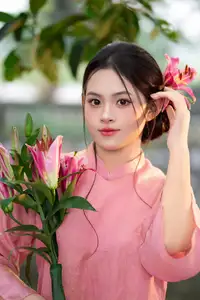Elegant Pink Ao Dai Amidst Ancient Architecture Capturing Timeless Traditional Beauty - image 7