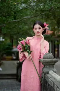 Elegant Pink Ao Dai Amidst Ancient Architecture Capturing Timeless Traditional Beauty - image 5
