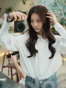 Karen Nguyen radiates effortless elegance in a classic white shirt minimalist look - image 6