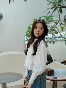 Karen Nguyen radiates effortless elegance in a classic white shirt minimalist look - image 1