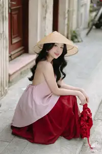Graceful Vietnamese Beauty: Conical Hat Muse Shines in Ancient Setting - image 12