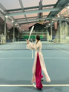 Miss Luong Thuy Linh Stuns in Traditional Ao Dai on the Tennis Court - image 0