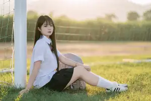 Youthful Schoolgirl in Uniform: Serene Golden Hour Beauty, a Glimpse into Nostalgic Student Life. - image 11