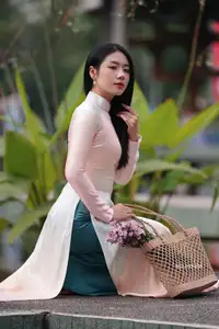 Captivating Grace: Vietnamese Girl in Traditional Ao Dai Beauty 1000025136 - image 15