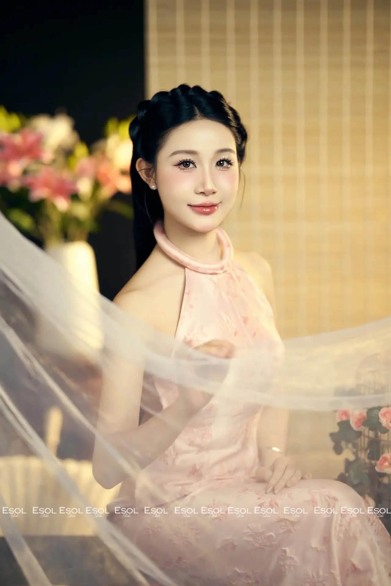 Serene Asian Beauty: Discover A Graceful Woman In A Traditional Pink Dress Amidst Blossoms.