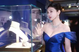 Radiant in Blue: A Woman's Elegant Charm Shines Bright in a Luxurious - image 4