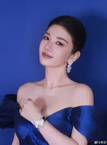 Radiant in Blue: A Woman's Elegant Charm Shines Bright in a Luxurious - image 6