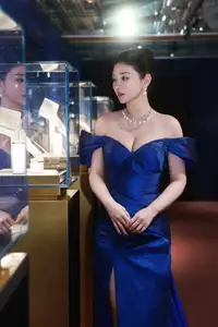 Radiant in Blue: A Woman's Elegant Charm Shines Bright in a Luxurious - image 0