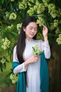 VGU No.172: Captivating Vietnamese Ao Dai Student in a Dreamy Moment, Showcasing Pure Grace Amidst Nature. - image 11