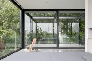 Minimalist Sanctuary: Elevating Modern Living with Floor-to-Ceiling Glass Walls and Lush Indoor Greenery - image 4