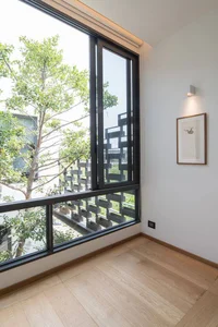 Minimalist Sanctuary: Elevating Modern Living with Floor-to-Ceiling Glass Walls and Lush Indoor Greenery - image 11