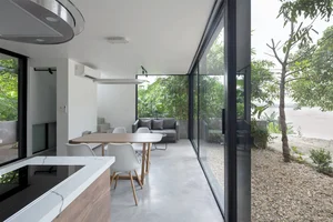 Minimalist Sanctuary: Elevating Modern Living with Floor-to-Ceiling Glass Walls and Lush Indoor Greenery - image 15