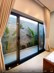 Minimalist Sanctuary: Elevating Modern Living with Floor-to-Ceiling Glass Walls and Lush Indoor Greenery - image 16