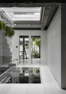 Minimalist Sanctuary: Elevating Modern Living with Floor-to-Ceiling Glass Walls and Lush Indoor Greenery - image 2