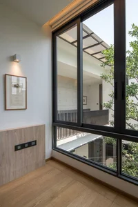 Minimalist Sanctuary: Elevating Modern Living with Floor-to-Ceiling Glass Walls and Lush Indoor Greenery - image 9