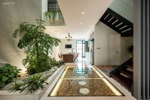 Minimalist Sanctuary: Elevating Modern Living with Floor-to-Ceiling Glass Walls and Lush Indoor Greenery - image 6