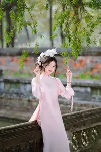 Elegant Vietnamese Beauty: Young Woman Gracefully Posing in Pink Ao Dai with White Orchids 1000026874 - image 8