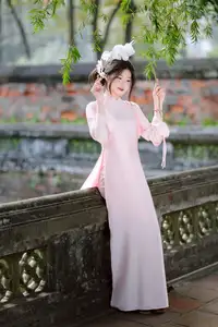 Elegant Vietnamese Beauty: Young Woman Gracefully Posing in Pink Ao Dai with White Orchids 1000026874 - image 13