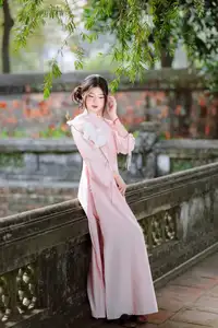 Elegant Vietnamese Beauty: Young Woman Gracefully Posing in Pink Ao Dai with White Orchids 1000026874 - image 0