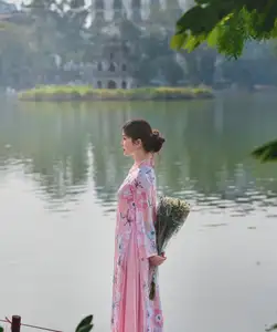 Elegant Asian Beauty: Graceful Woman in Modern Ao Dai by Serene Lakeside - image 8