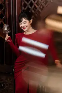 Captivating Asian Beauty: The Elegant Woman in Red with a Charming Smile and Confident Aura - image 2