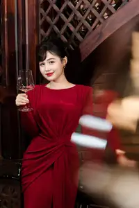 Captivating Asian Beauty: The Elegant Woman in Red with a Charming Smile and Confident Aura - image 1