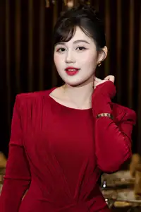 Captivating Asian Beauty: The Elegant Woman in Red with a Charming Smile and Confident Aura - image 5