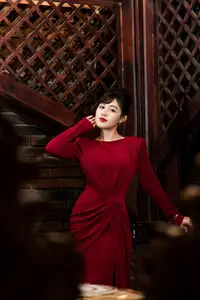 Captivating Asian Beauty: The Elegant Woman in Red with a Charming Smile and Confident Aura - image 0